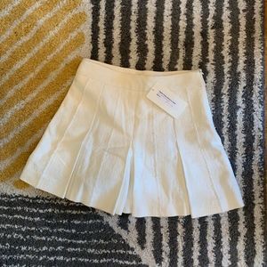 Ivory pleated shorts with tags